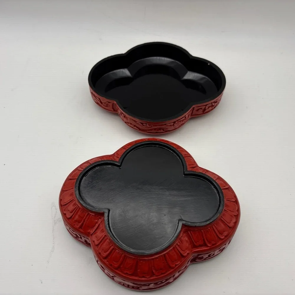 Red Cinnabar style detailed clover shaped decorative box black inside